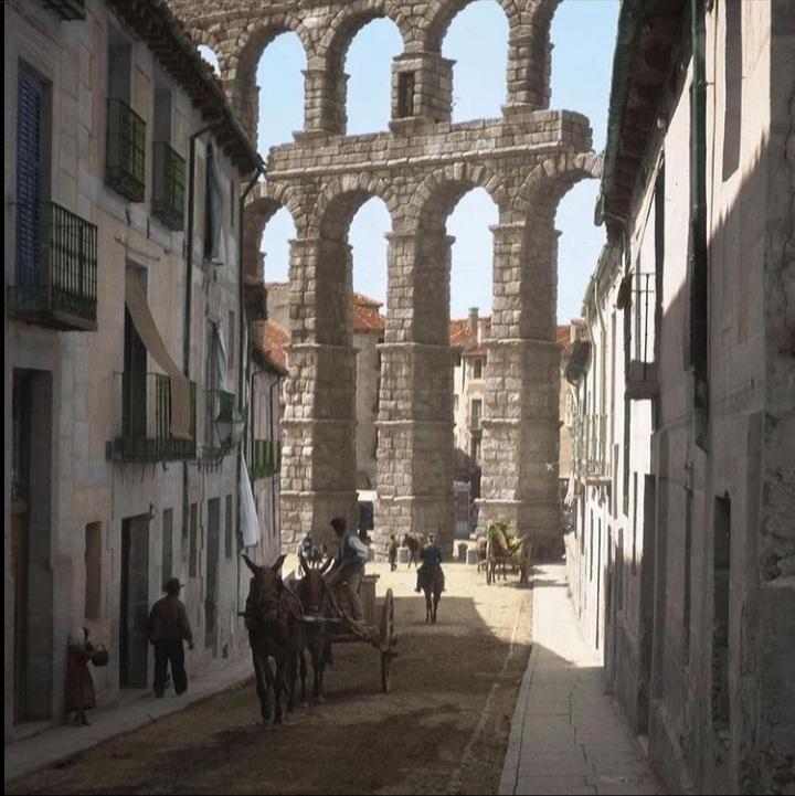 A street in the city of Segovia in Spain, c. 1904. In the background you can see the Aqueduct of Segovia, one of the most famous from Ancient Rome.jpg