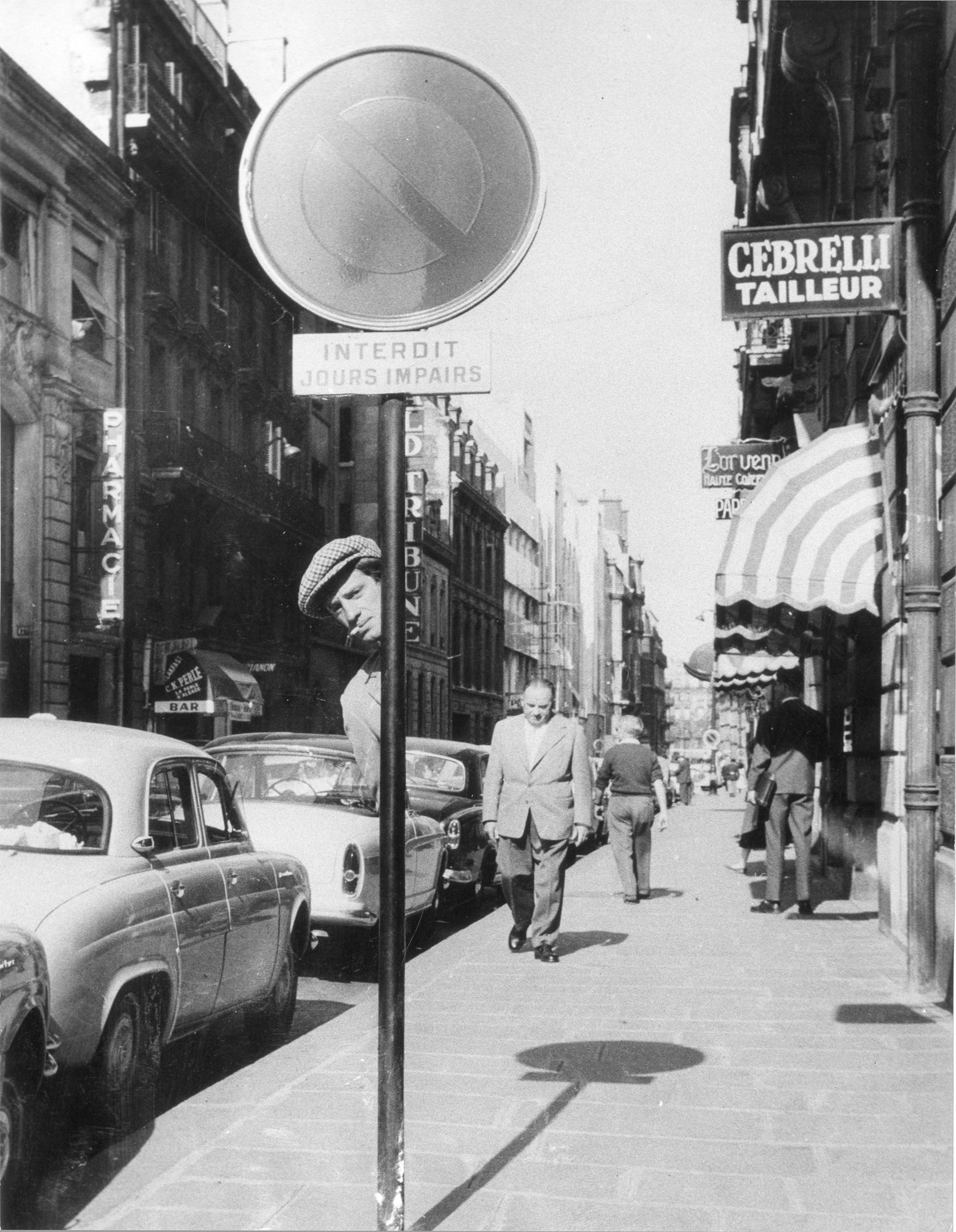 Raymond Cauchetier, Jean-Paul Belmondo on the set of A bout de Souffle directed by Jean-Luc Godard, 1960.jpg