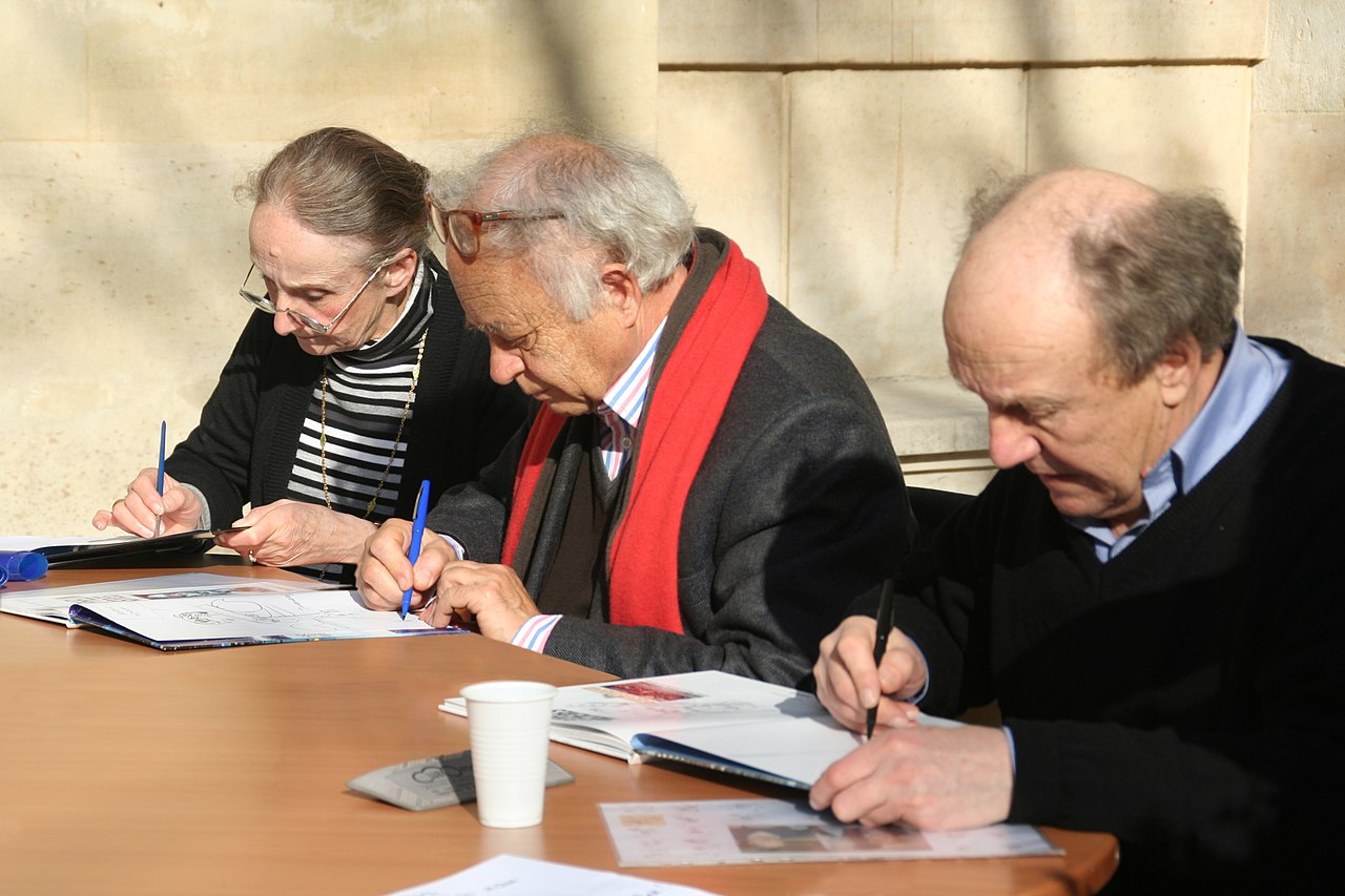 Évelyne Tranlé, Pierre Christin, Jean-Claude Mézières  lors d'une séance de dédicaces pendant le festival BD des Grandes Écoles de Paris, 28.02.2009.jpg