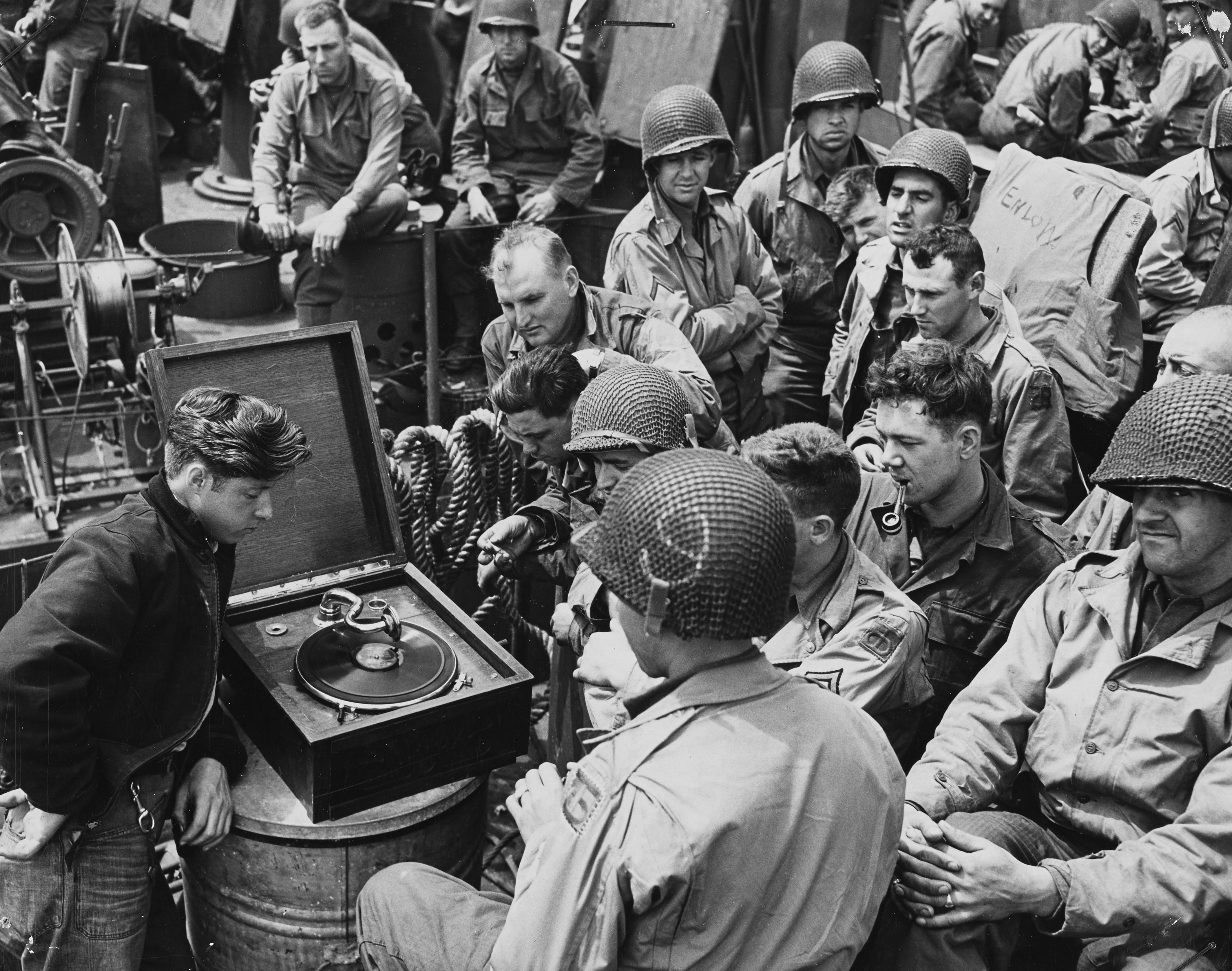 American troops off to battle towards the coast of France, while listening to records. English Channel, 1944.jpg
