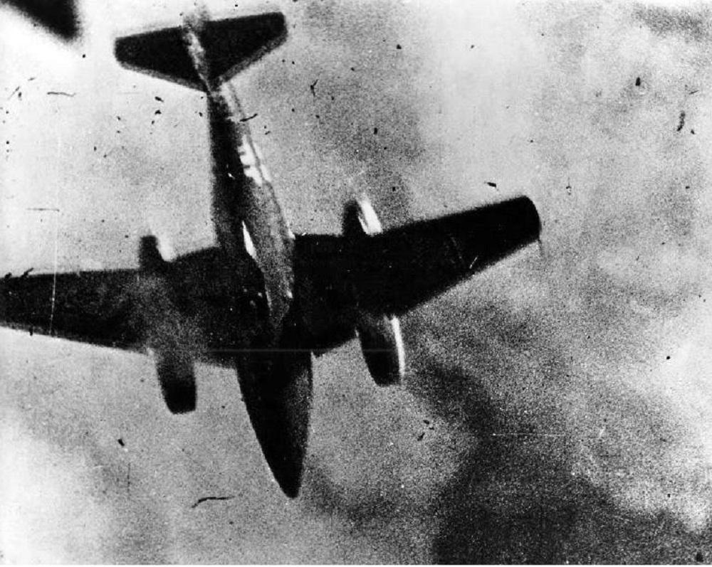 A German Me 262 flashes through the frame of an American P-51 Mustang gun camera, 1945.jpg