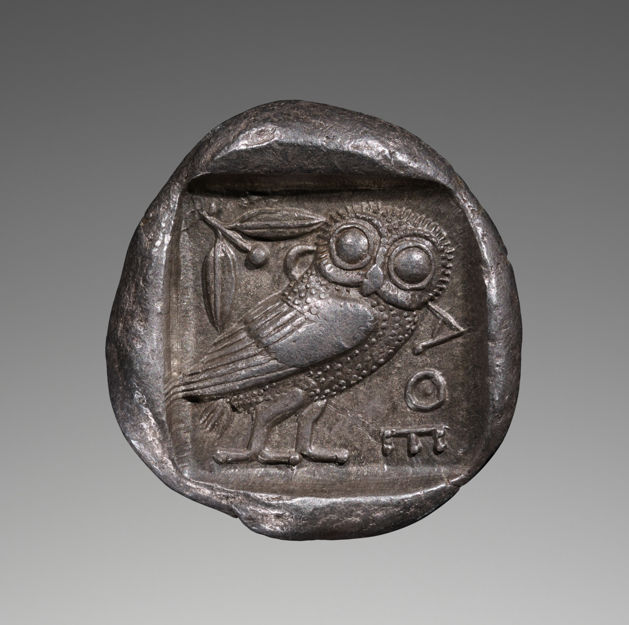 An Athenian silver tetradrachm ca. 475–465 B.C., showing Athena's owl and an olive branch.jpg