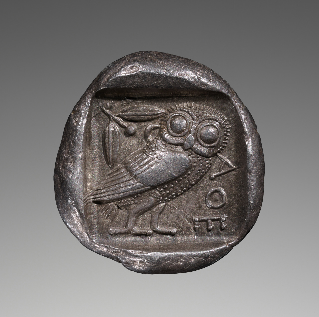 An Athenian silver tetradrachm ca. 475–465 B.C., showing Athena's owl and an olive branch.jpg
