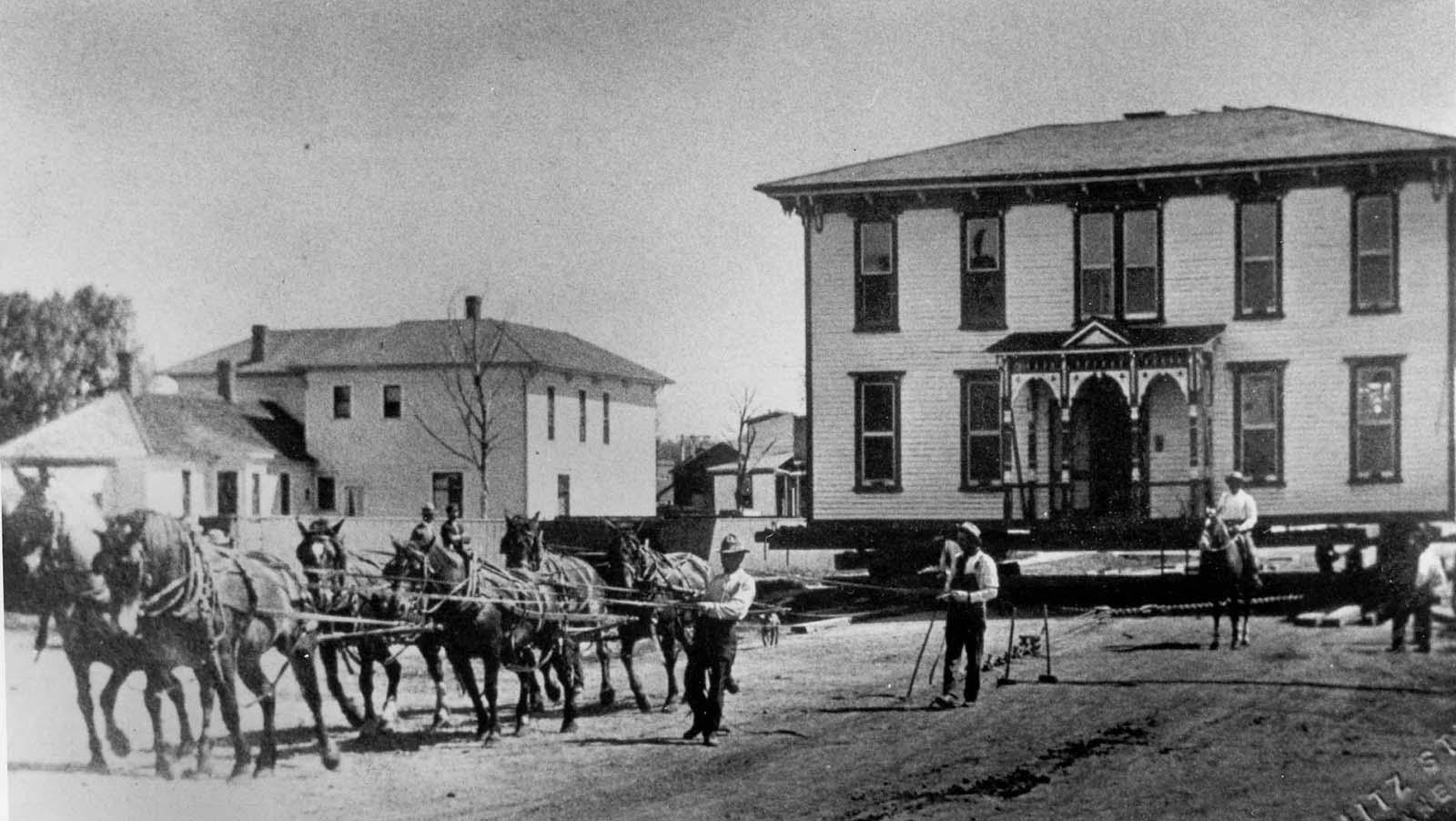 Moving a house by horsepower. Actual horse...power. Late 1800's.jpg