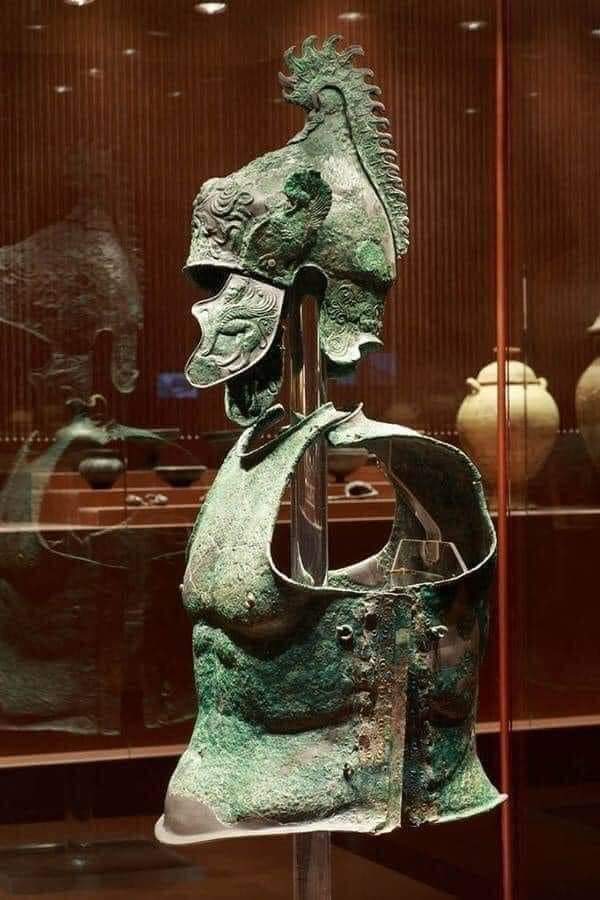 Etruscan (or Greek from Magna Graecia) bronze Phrygian type helmet and muscled cuirass from Arezzo in Tuscany, the 4th century BC.jpg