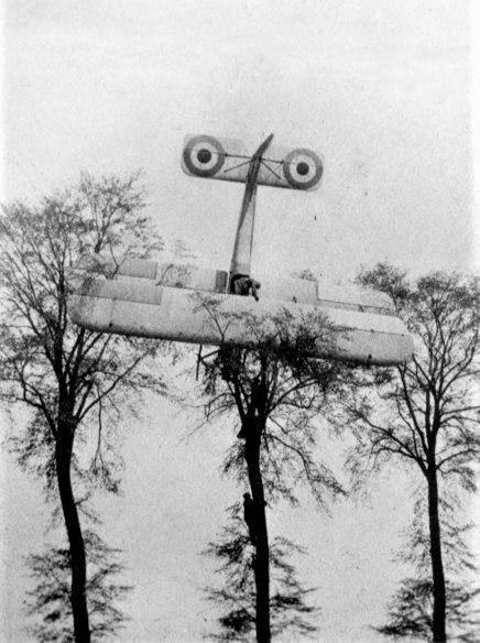 WWI french pilot who made an emergency landing and is exiting from his plane, Belgium 1915.jpg