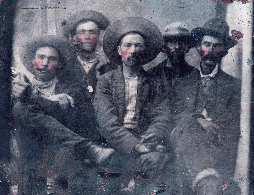 This tintype shows what historians believe is a photo of outlaw Billy the Kid, second from left, and his killer Pat Garrett , far right, taken in 1880.jpg