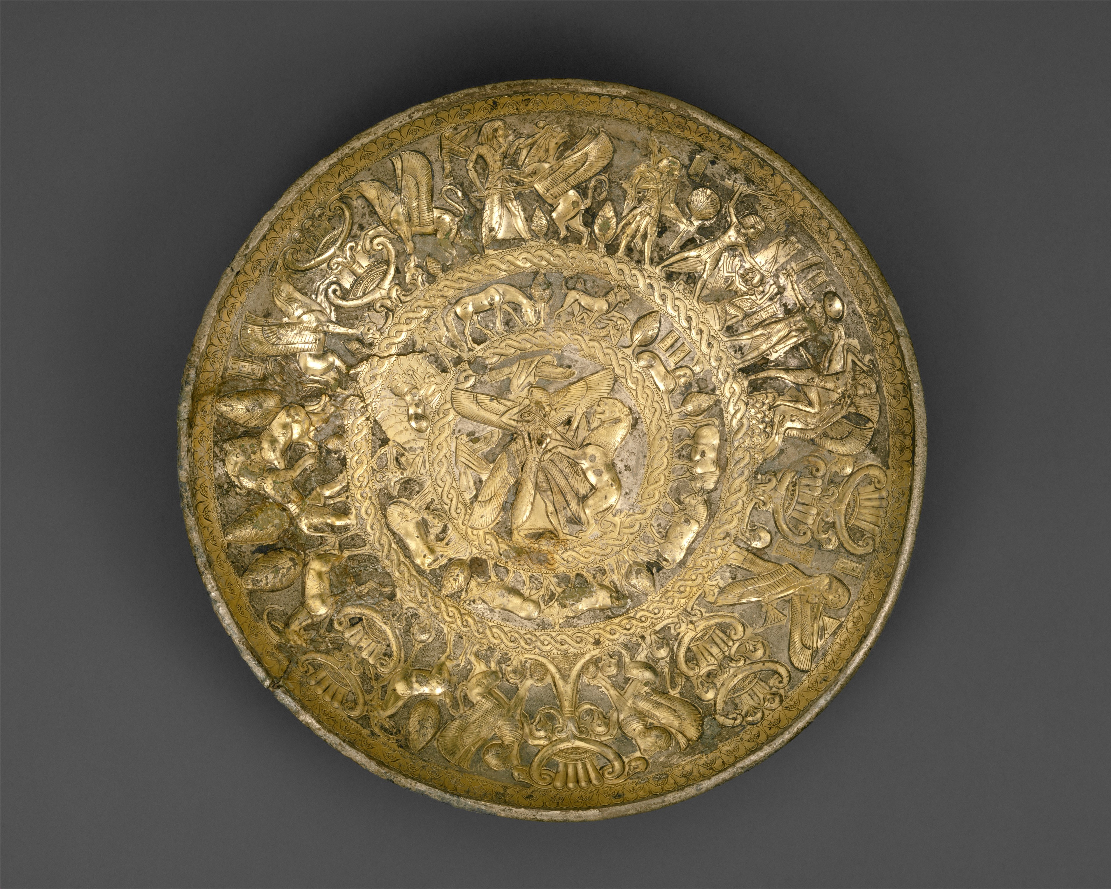 Silver-gilt bowl from ancient Cyprus depicting influences from Egypt, Assyria, and Phoenicia, ca. 725–675 BCE.jpg