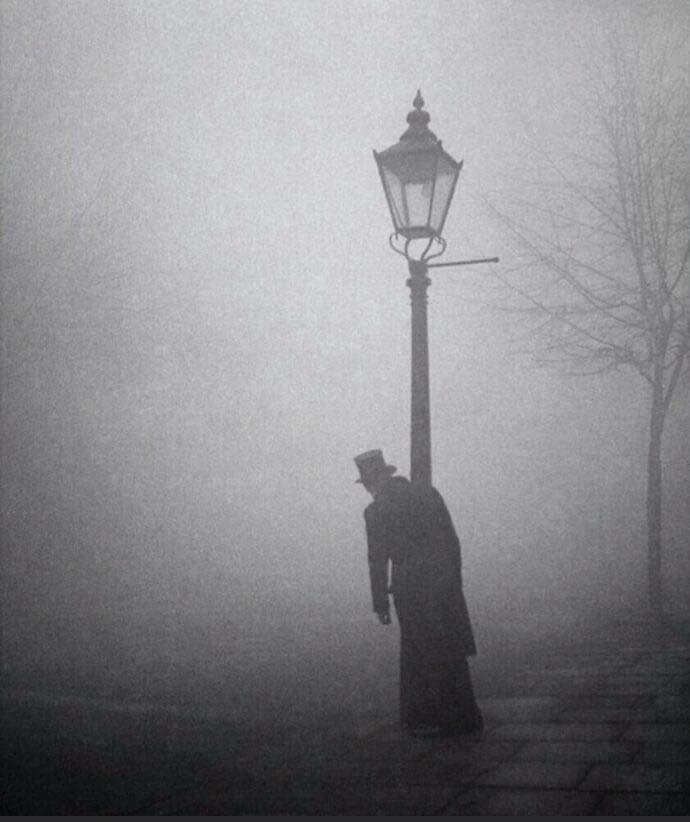 A Drunken Man In Top Hat And Tails Clings To A Lamp-Post, London, 1934.jpg