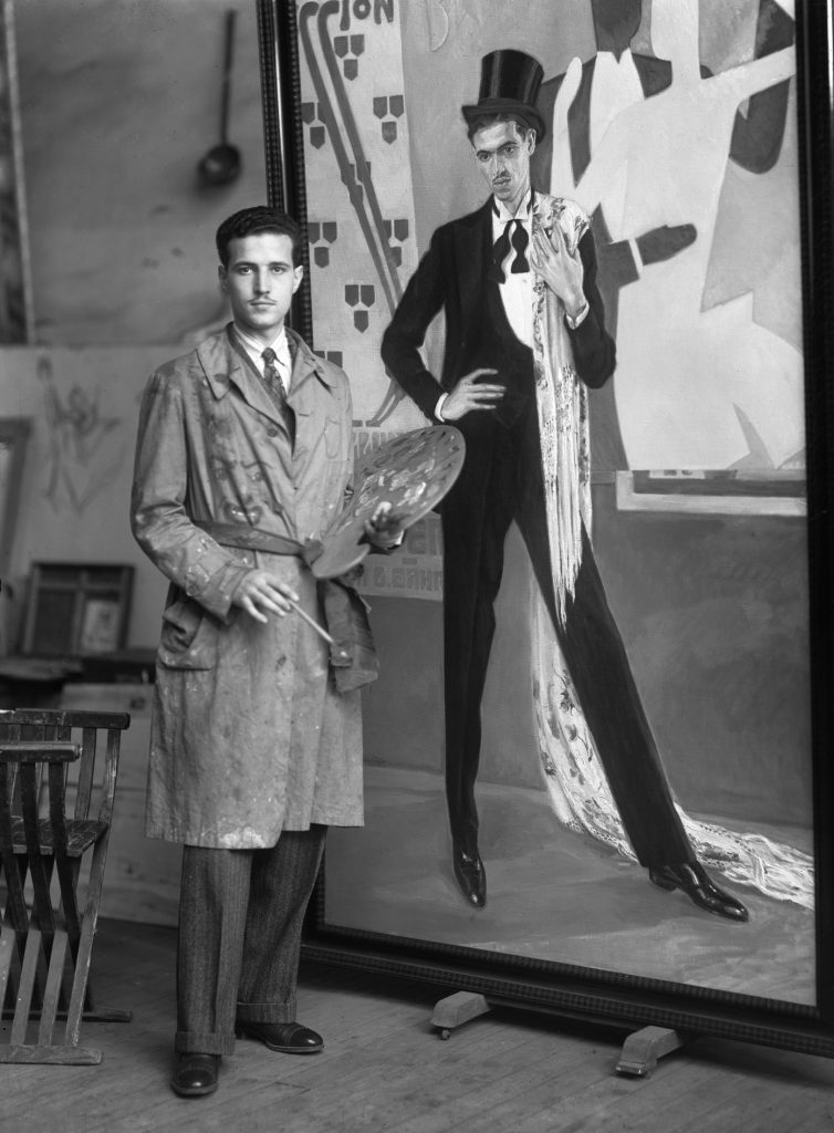 My great grandfather posing next to one of his paintings in an art exhibition in pre civil war Spain.1930~1933.jpg