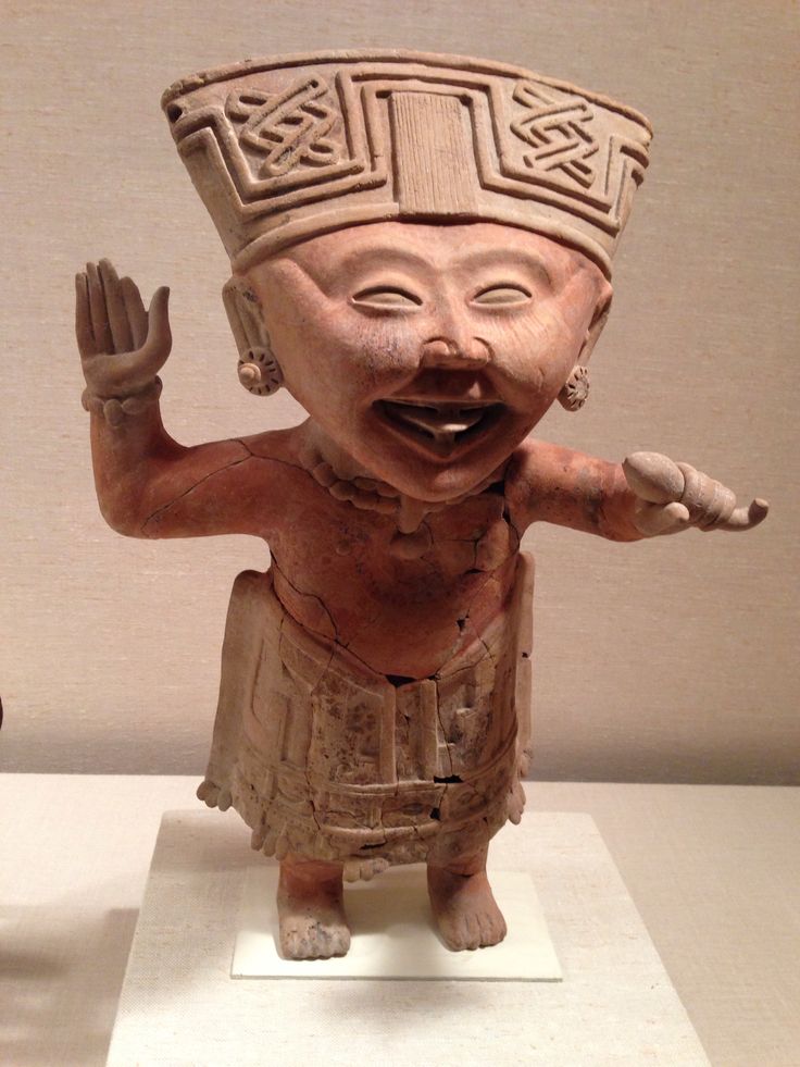A ceramic smiling figure from Veracruz, Mexico. Remojadas Culture, 7th–8th century CE, now housed at the Metropolitan Museum.jpg