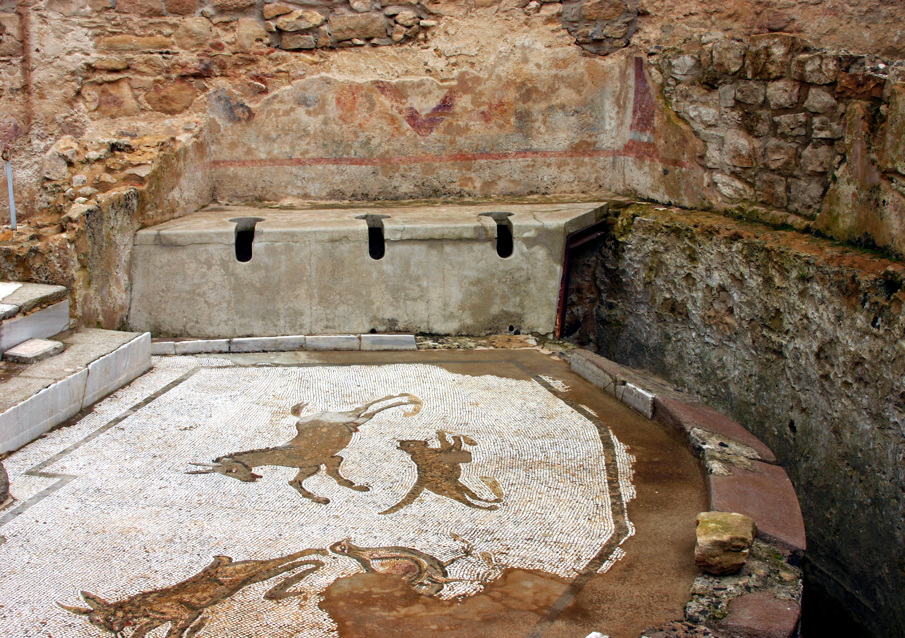 Roman toilets at Villa Romana del Casale in Sicily. 4th cent. A.D..jpg