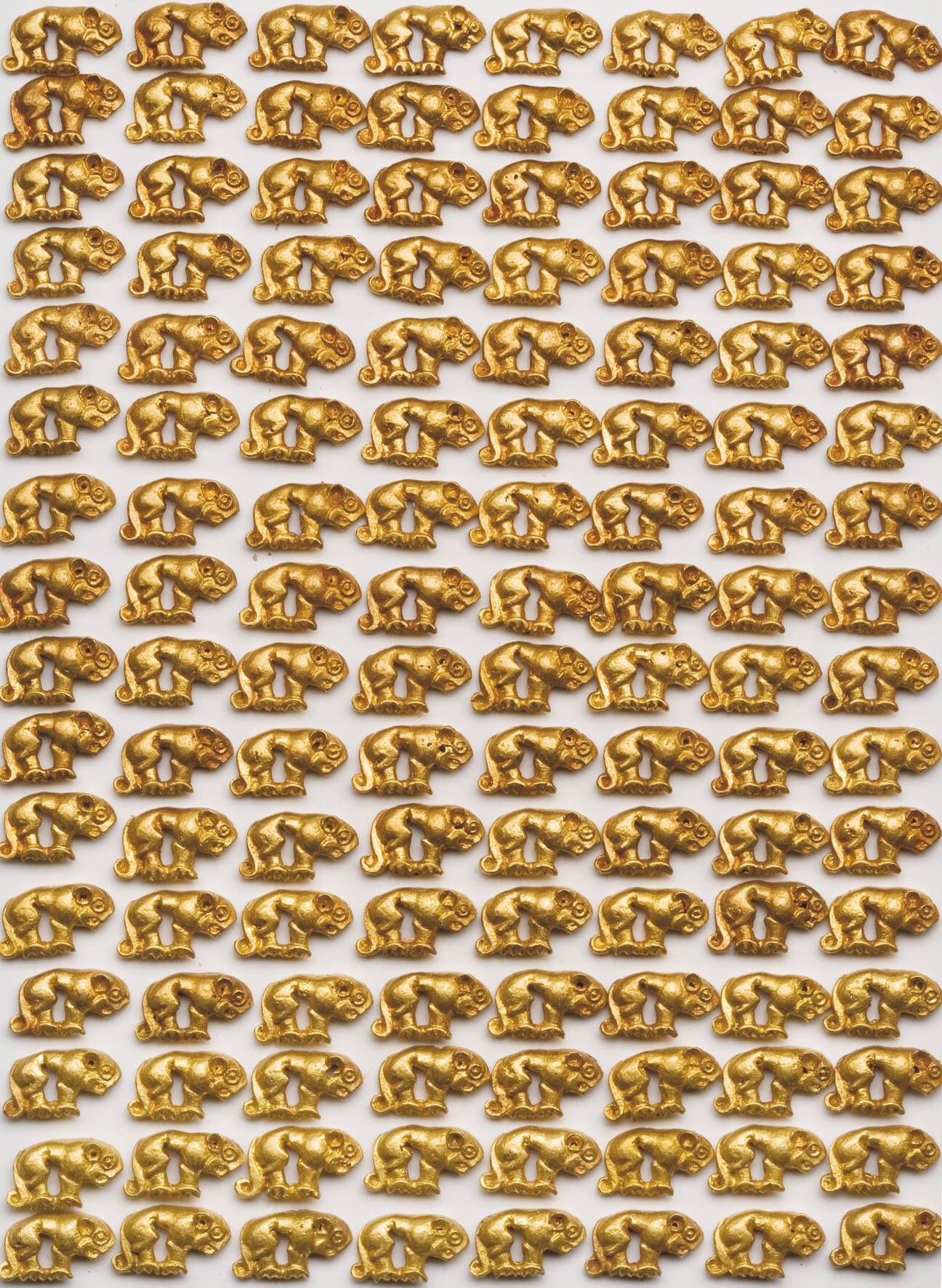 A portion of a 2500 golden panther figurines that decorated the jacket of a man who was found buried in Arzhan-2, a Scythian kurgan burial in the Tuva Republic in Russia. Late 7th century BCE, now on display at the National Museum of Tuva.jpg