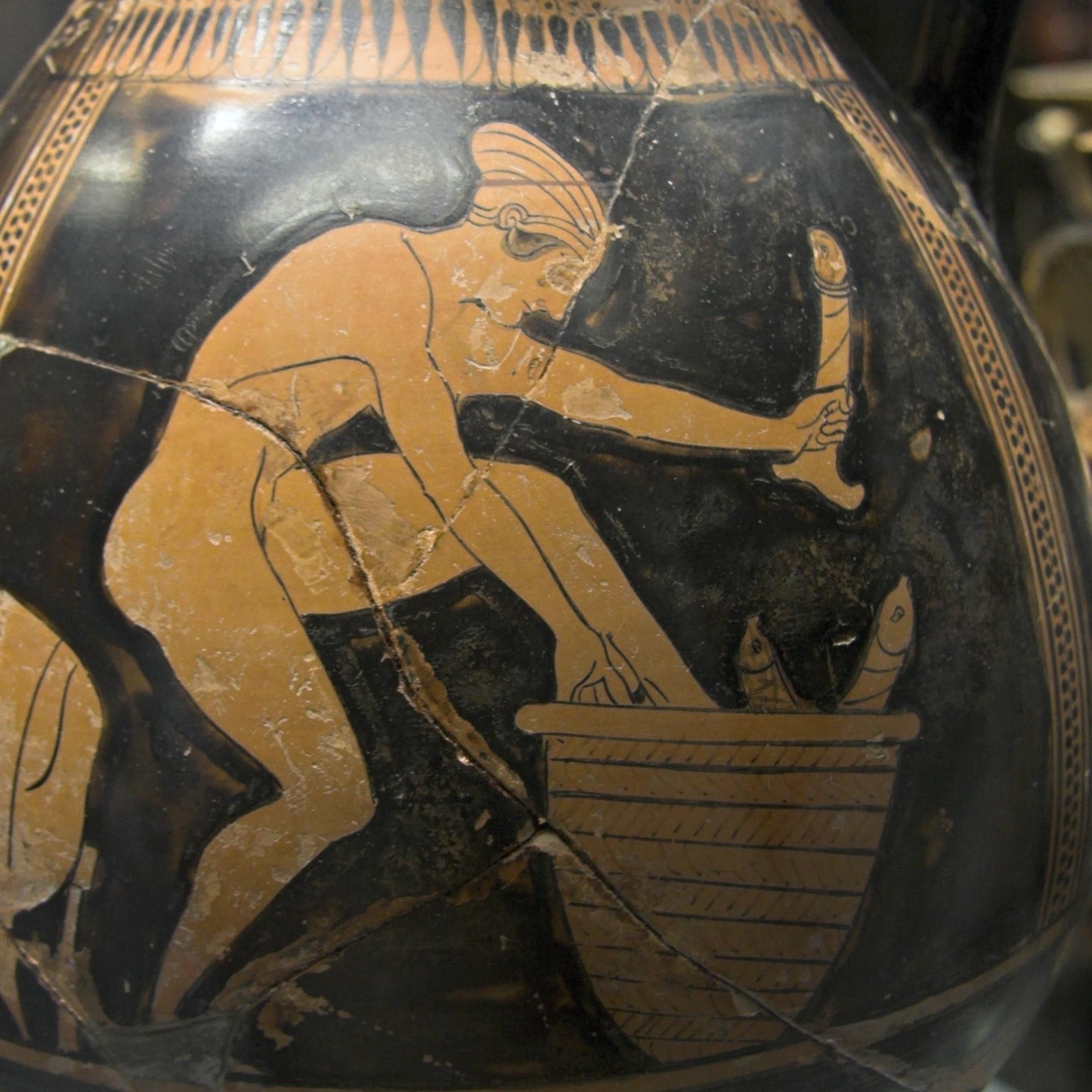 An attic red figure amphora depicting a naked woman in the vicinity of a basket containing large models of phalluses. 480-475 BCE, now housed at the Museo Archeologico Regionale Paolo Orsi of Syracuse in Sicily.jpg