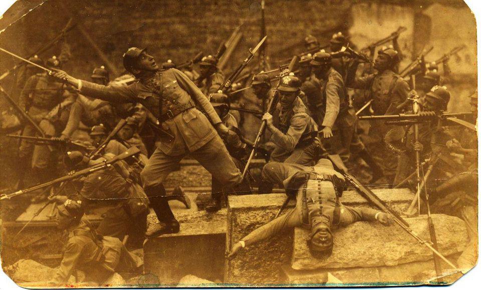 The Firefighter Corps of Rio de Janeiro simulating a bayonet charge for the camera, wearing Pickelhaube helmets without spike, 1910s.jpg