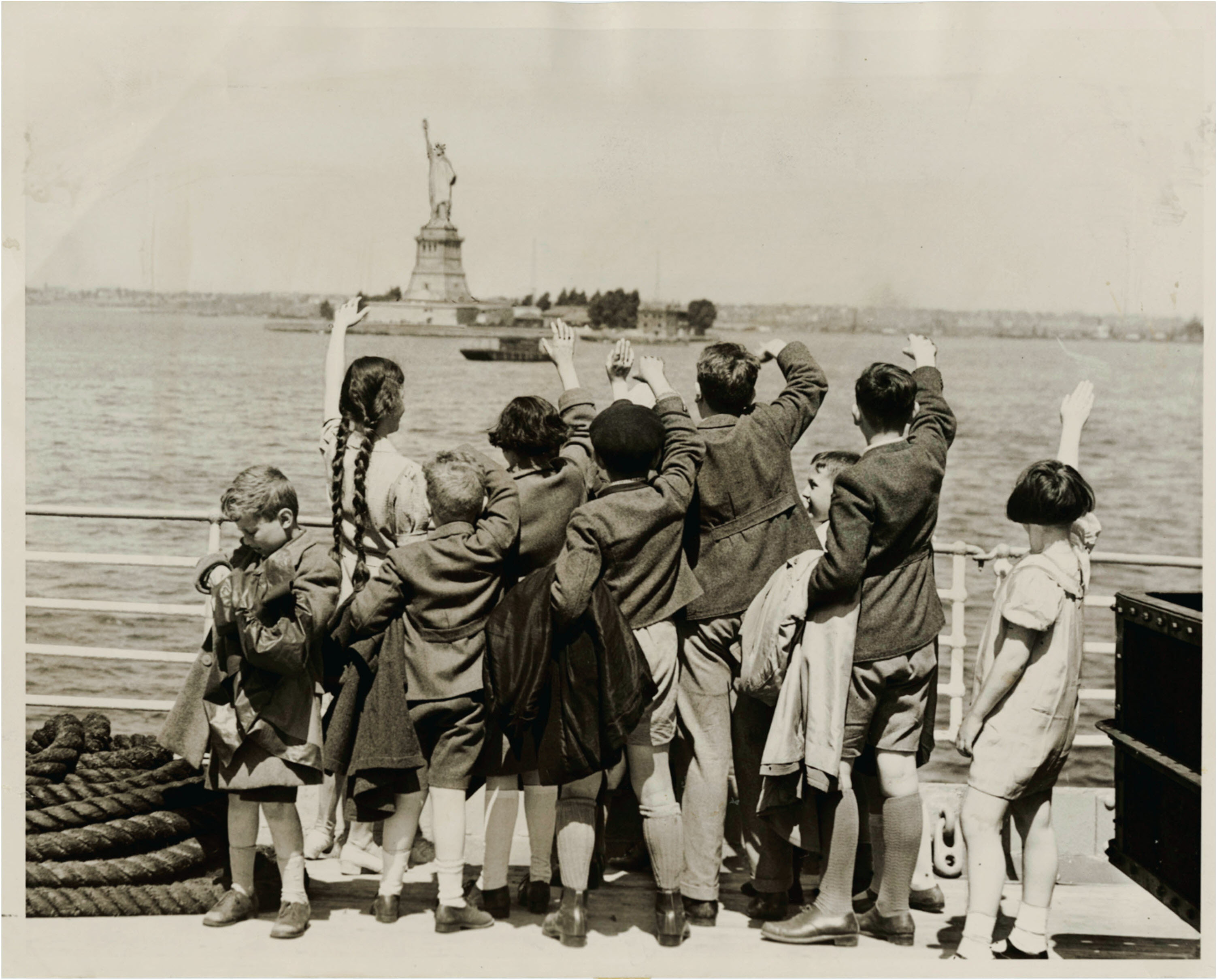 Children fleeing Nazis wave hello to Statute of Liberty, 1940s.jpg