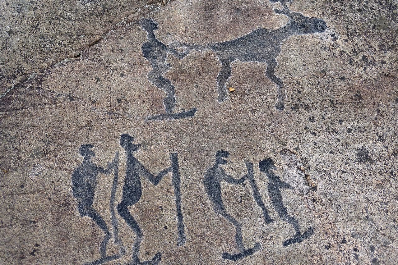 Petroglyph depicting 5 skiers and a reindeer located near the White Sea in Belomorsk Russia. 4000-3000 BC.jpg