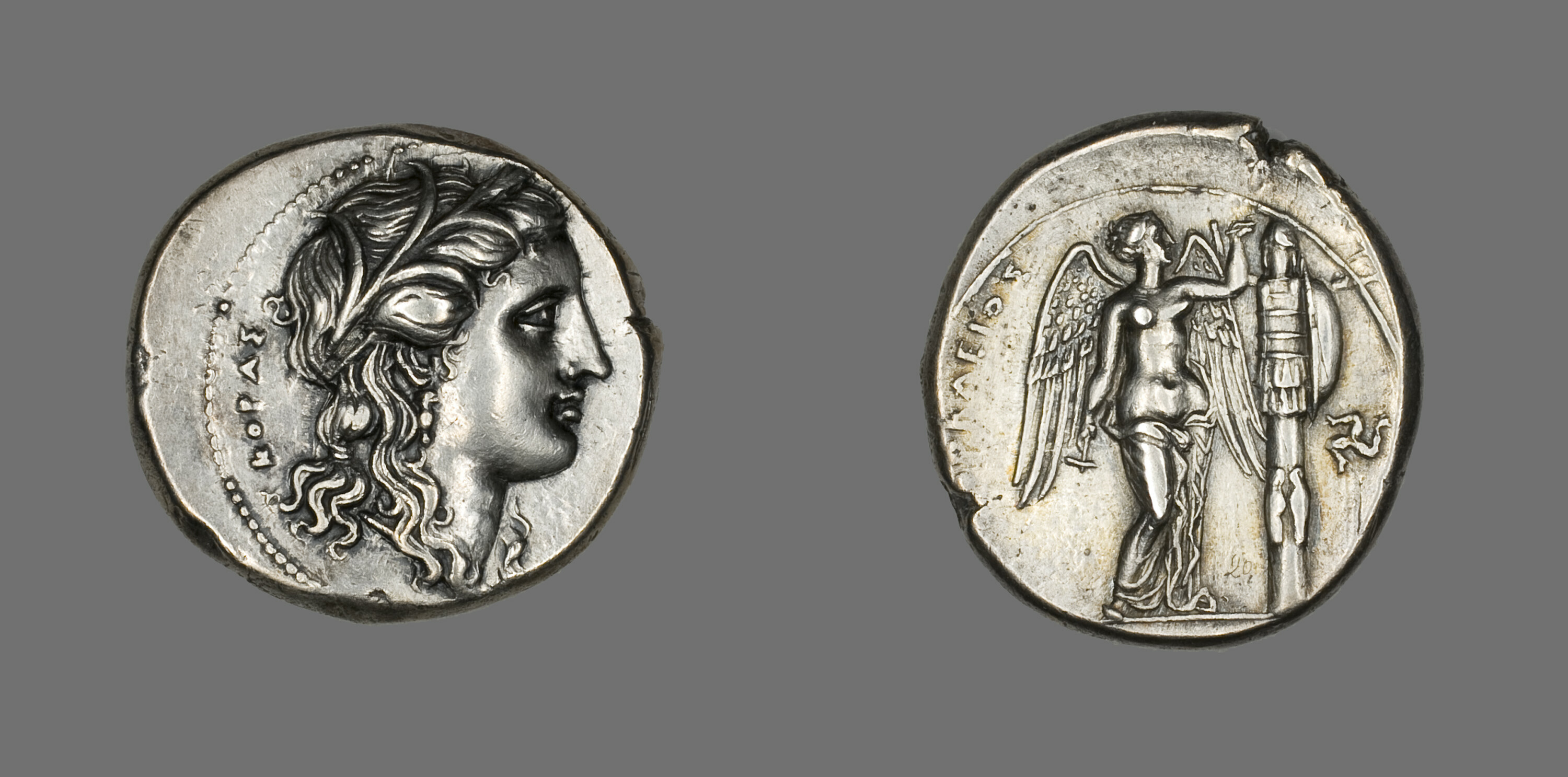 Silver tetradrachm from the ancient Greek city of Syracuse, depicting the goddess Persephone, 310-307 BCE.jpg