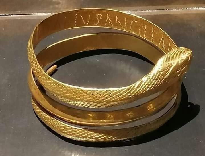A Roman gold snake bracelet found on the arm of a woman who was killed by Mount Vesuvius’ eruption in 79 CE near Pompeii, inscribed on the inside 'DOMINVS SVAE ANCILLAE' which means From a master to his slave girl.jpg