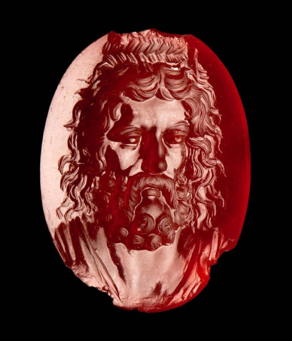 An oval carnelian intaglio engraved with Zeus-Serapis. Hellenistic Period, 2nd–1st century BCE, now housed at the Museum of Fine Arts in Boston.jpg