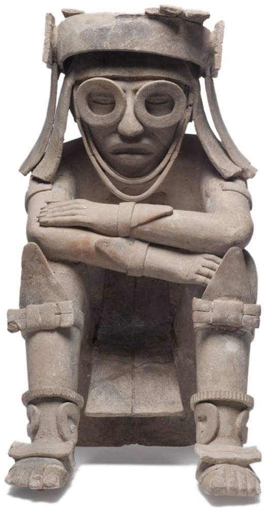 A clay seated figure with goggles from El Zapotal, Veracruz. 600-900 CE, now on display at the Xalapa Museum of Anthropology in Mexico.jpg