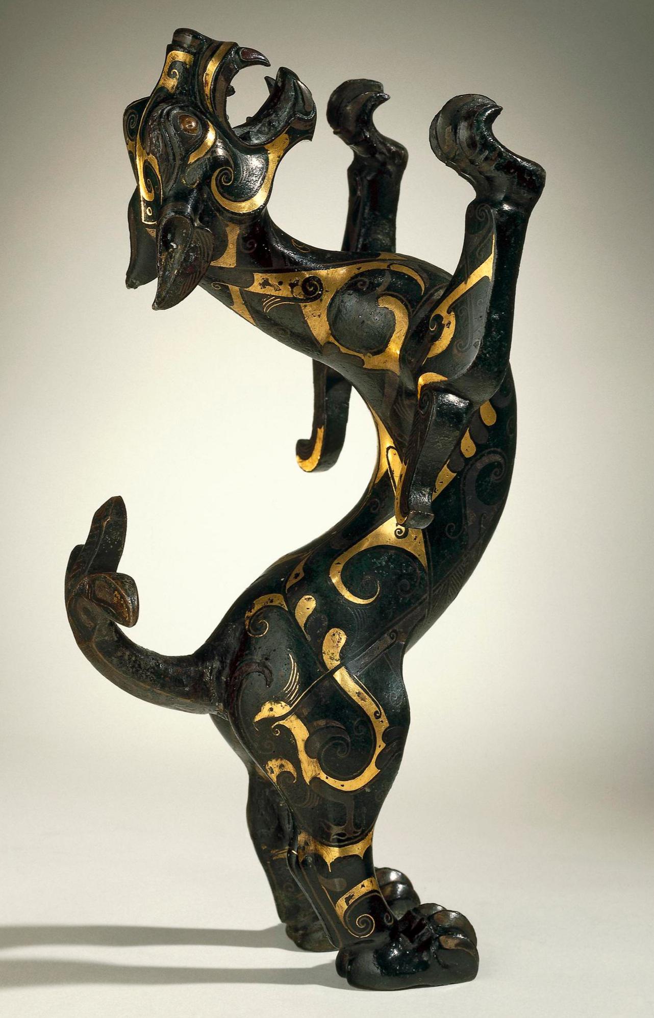 A bronze figure of a leaping feline, inlaid in gold and silver. From China, Eastern Zhou dynasty, 4th-3rd century BCE, now housed at the British Museum.jpg