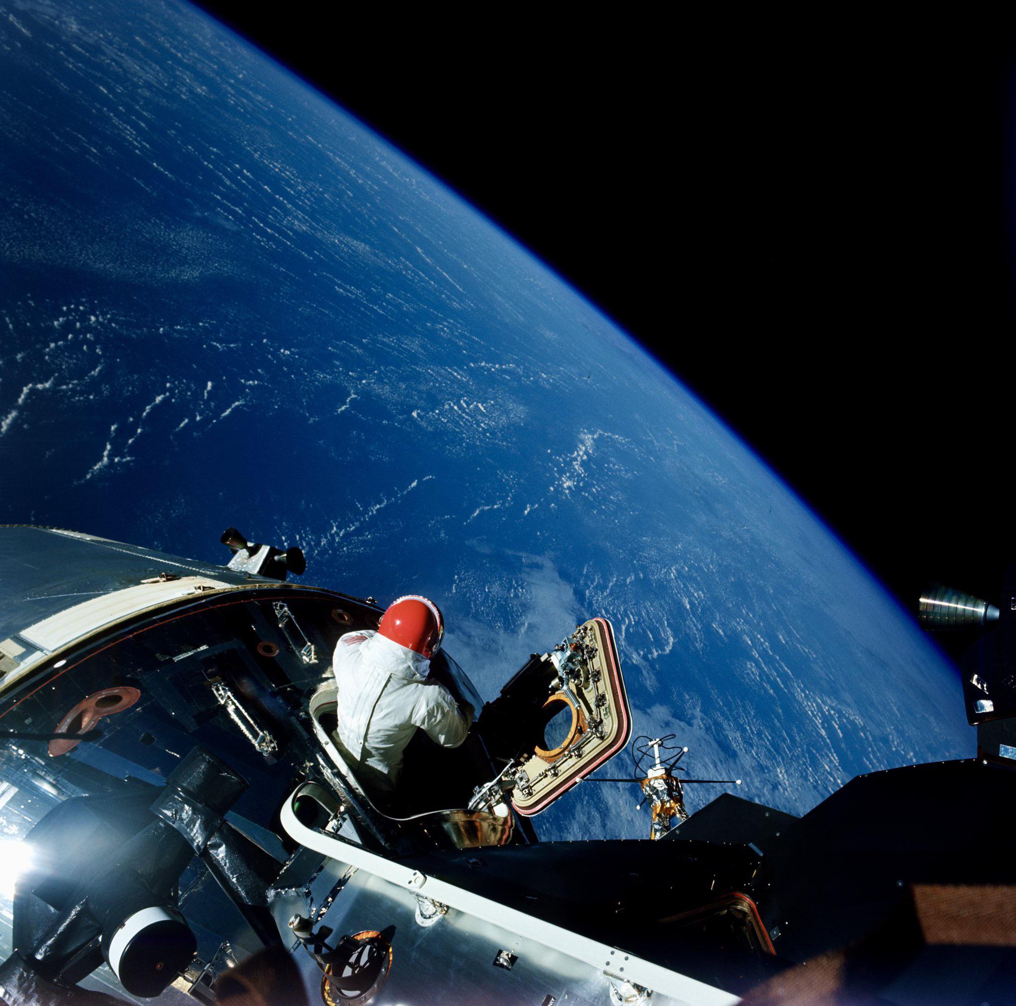 Dave Scott enjoys the view from the open hatch of the Apollo 9 command module, March 6, 1969.jpg
