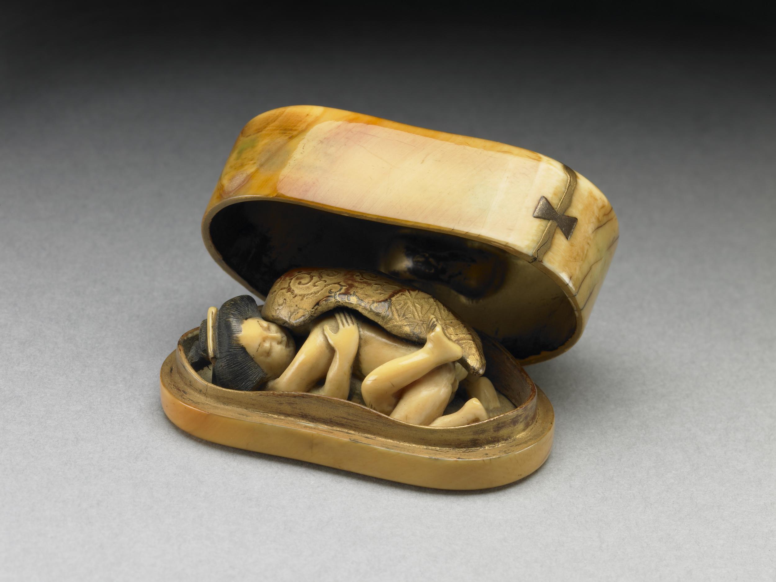 A netsuke box which opens to reveal a couple making love. Made of Ivory, gold and lacquer. Japan, Edo period, 18th century CE, now housed at the British museum.jpg