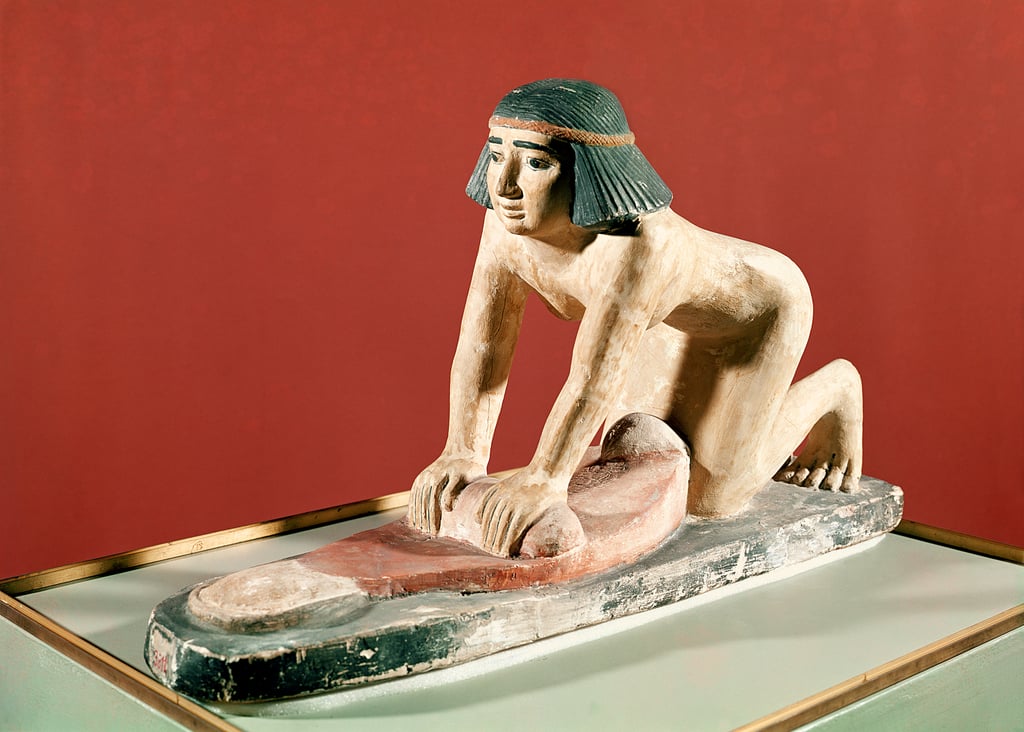 Egyptian model of a woman grinding grain, Old Kingdom. 25th century B.C..jpg