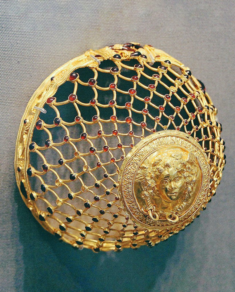 Ancient Greek lady's gold hairnet with a Medusa medallion. From the Greek city of Taras (Taranto, South Italy). ~Late 3rd Century BCE.jpg