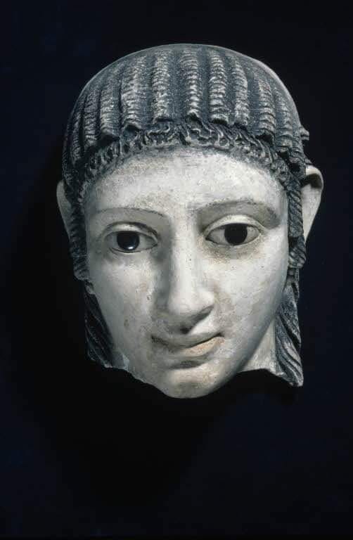 This mask, representing the face of a Greek woman, was placed over the mummy's face. Originally polychromatic, during the Roman period, this type of mask replaced the pharaonic mask. First century AD. Louvre Mu.jpg