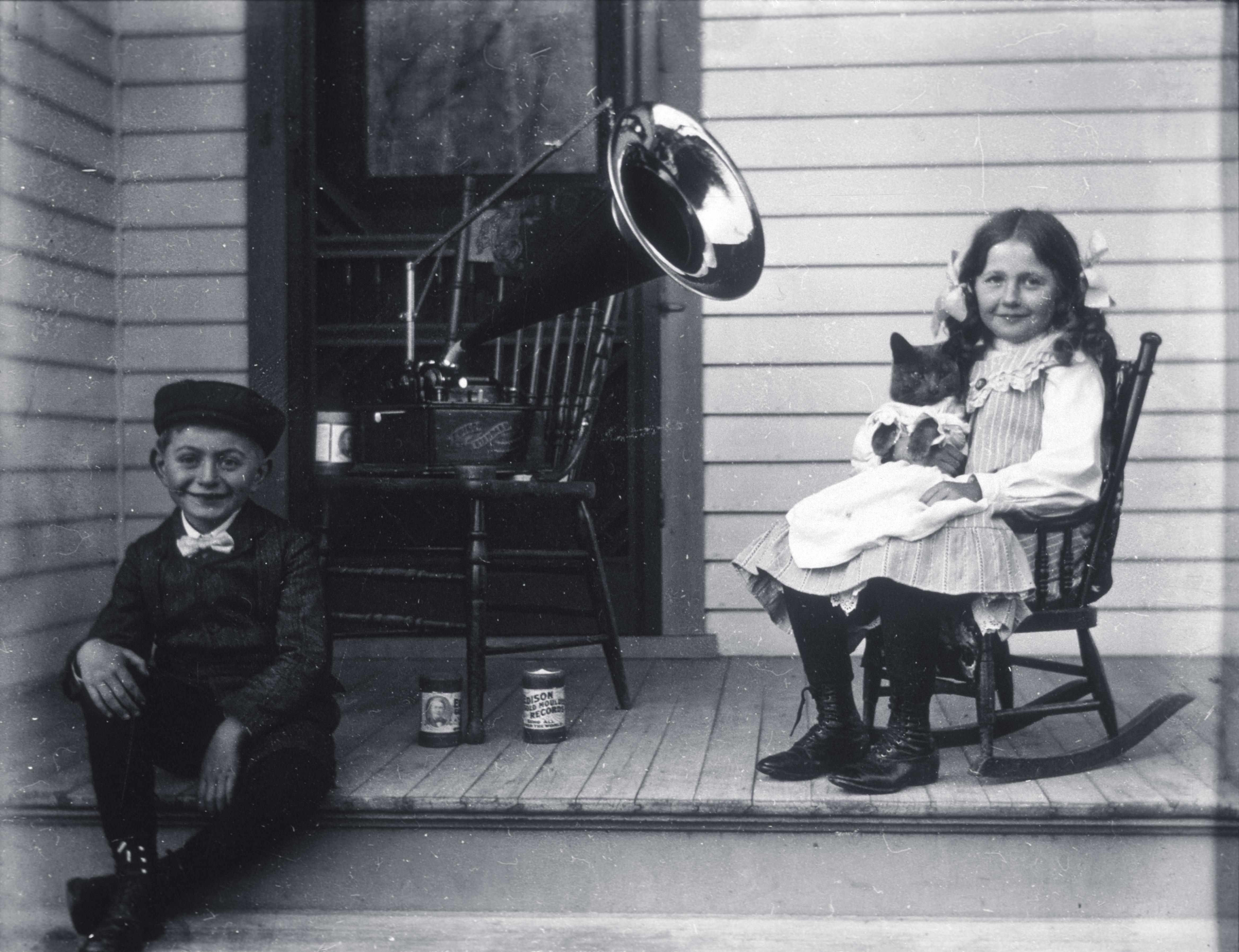 Edgar and Jennie Krueger pose with the family phonograph and Tramp the cat, 1905.jpg