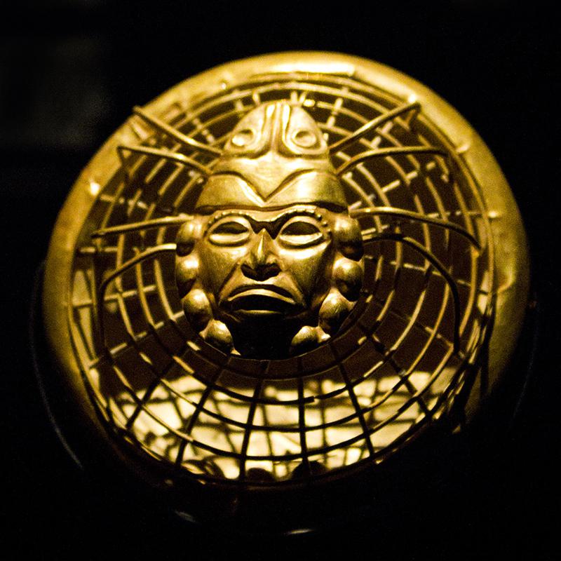 A bead from a Moche gold necklace, 300–390 AD, Peru, now housed at the royal tombs of Sipán museum, Lambayeque, Peru.jpg