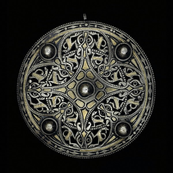 The Strickland Brooch, an Anglo-Saxon silver disc brooch with gold and niello inlay, decorated with intricate Trewhiddle-style animal pattern, c. mid-9th century AD.jpg