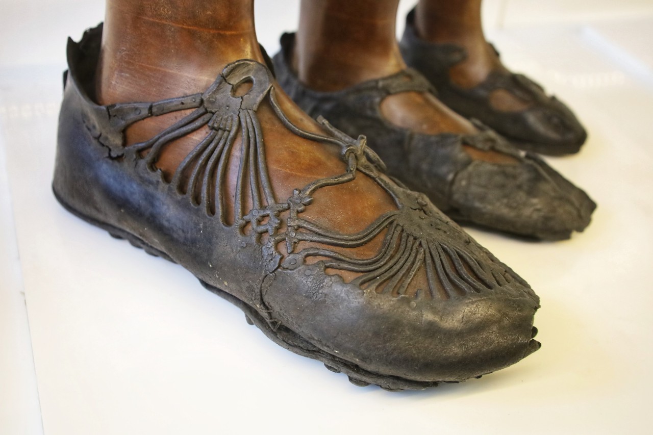 Roman Leather Shoes (Calcanei) for a man, woman and child, recovered at the Bar Hill Roman Fort, Antonine Wall.jpg
