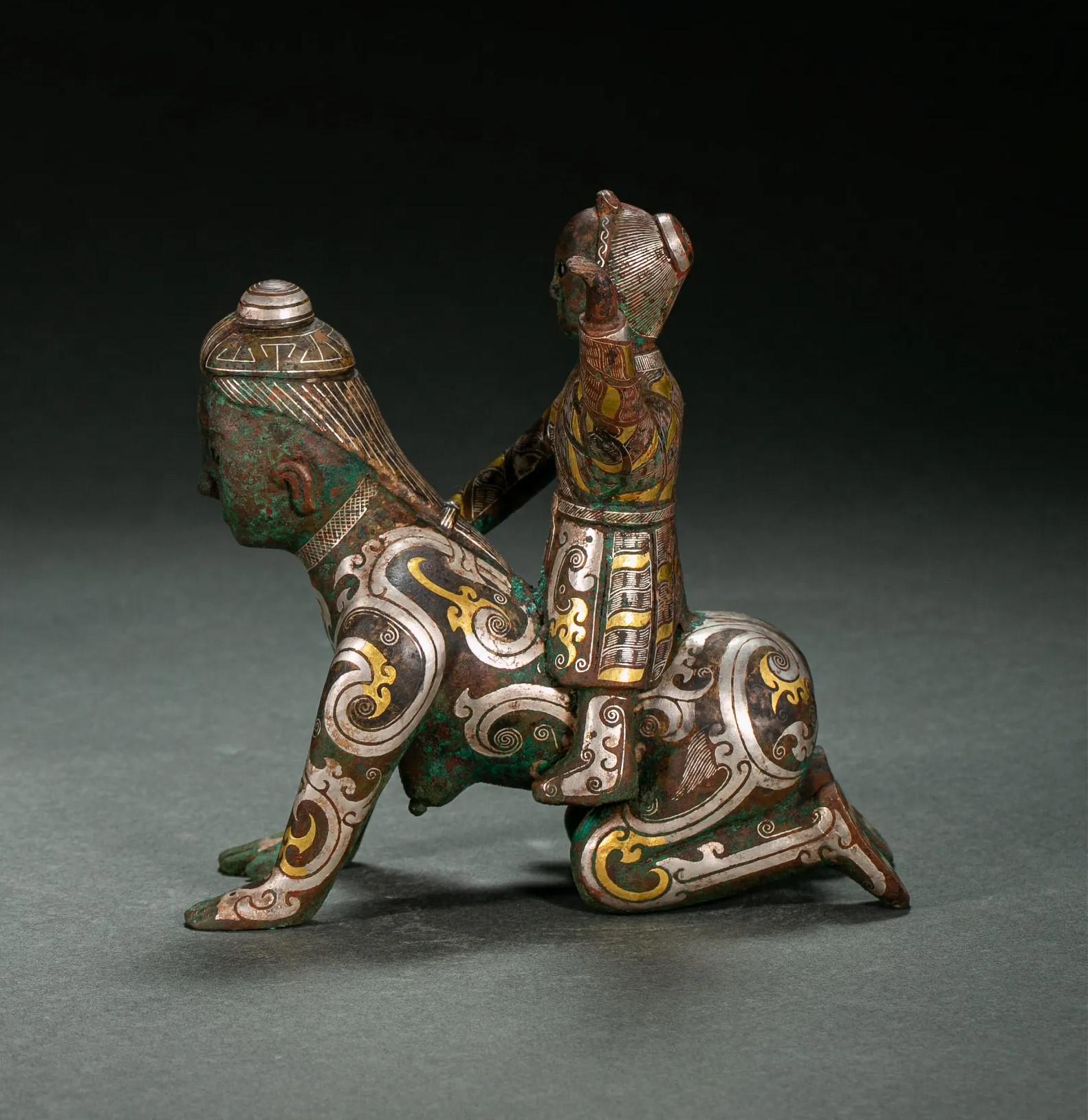 Chinese gold and silver inlaid bronze figures, Han dynasty (202 BC – 220 AD).jpg