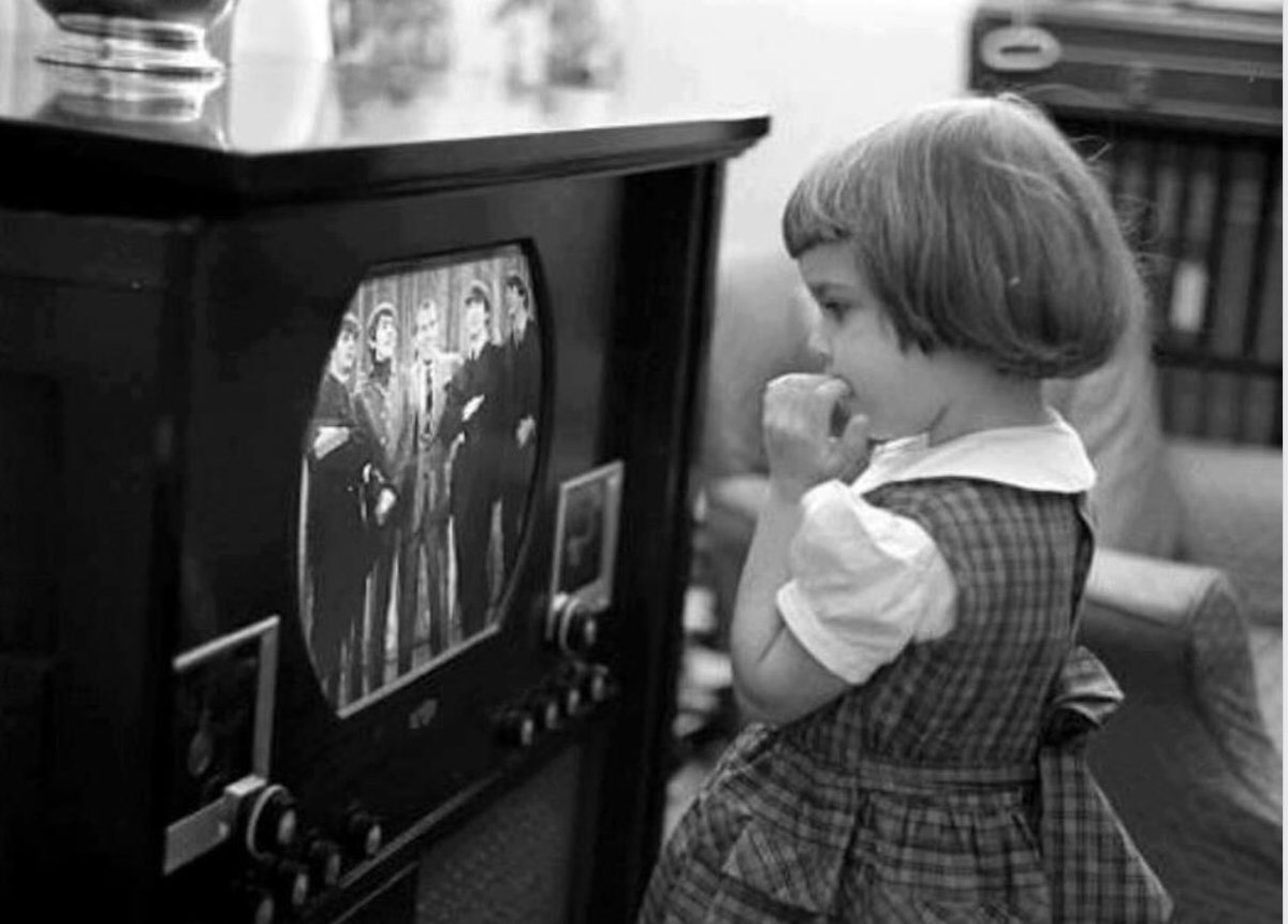 1964. Little girl watches the Beatles on the Ed Sullivan Show.jpg