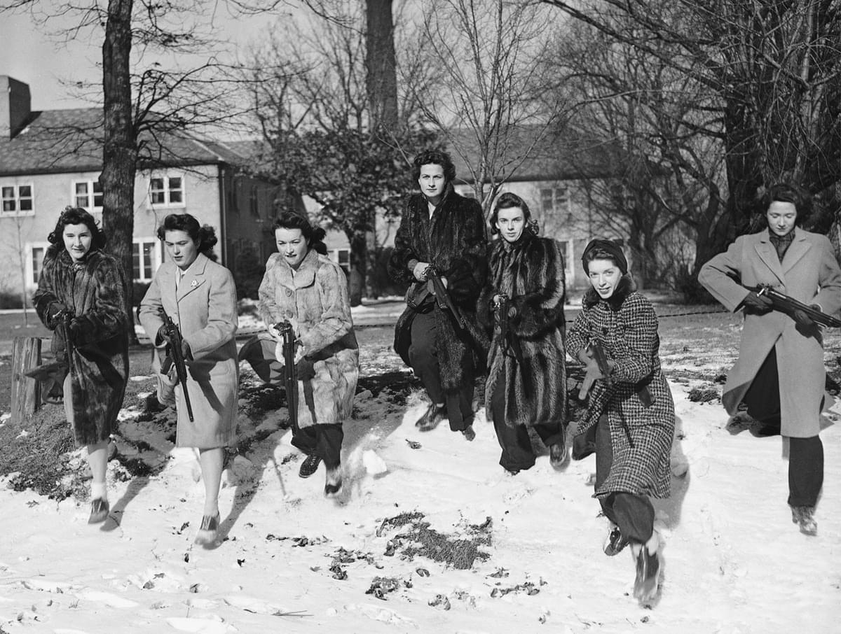 These Northwestern University girls brave freezing weather to go through a Home Guard rifle drill on the campus in Evanston, Illinois on January 11, 1942.jpg