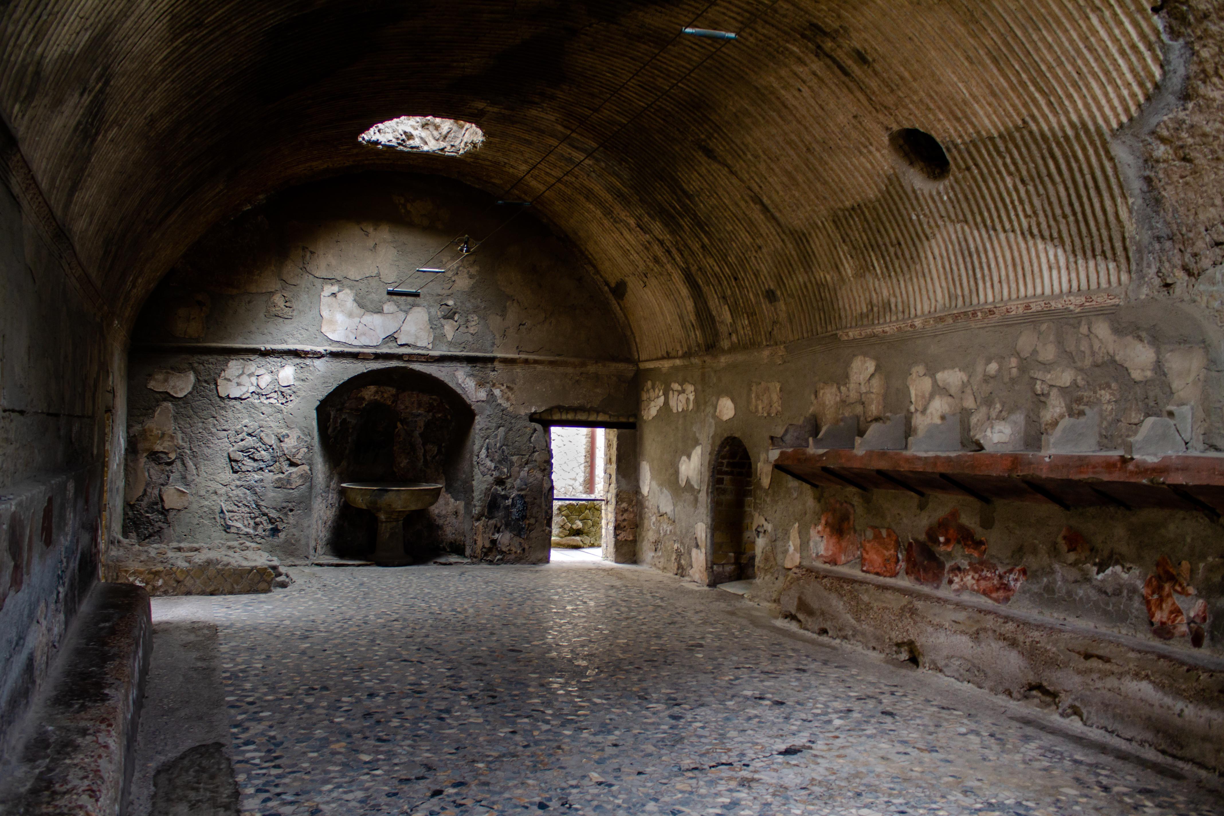 Roman baths preserved by Vesuvius, complete with shelves, home to pickpockets and tapeworms.jpg