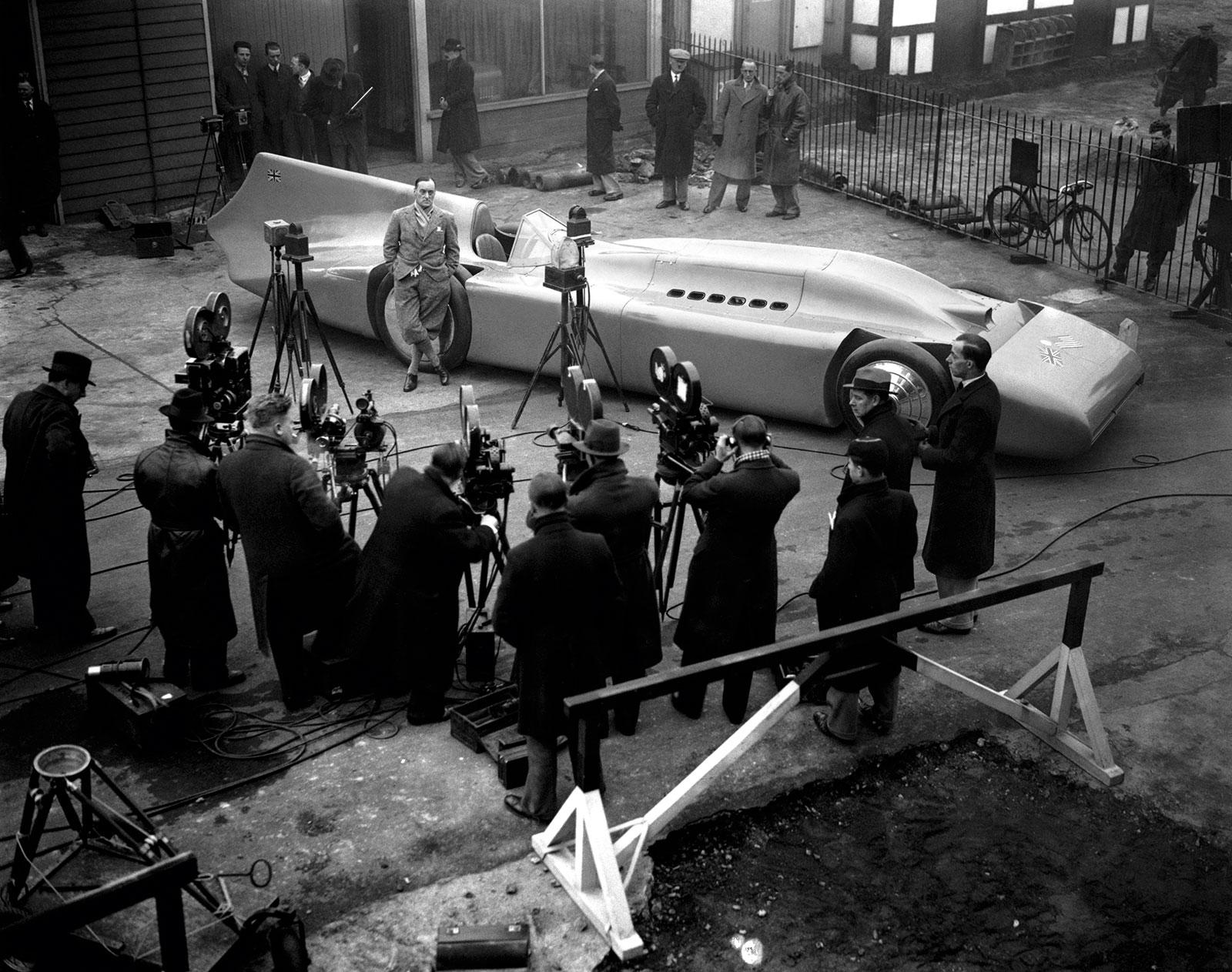 Sir Malcolm Campbell posing in front of his legendary Blue Bird. Daytona Beach, Florida, 1935.jpg