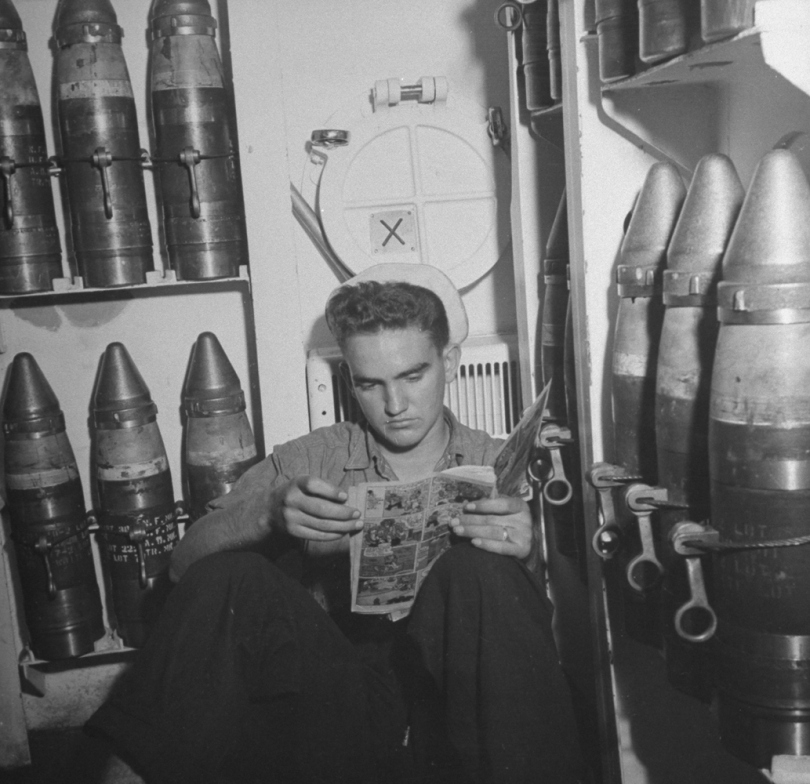 A sailor reads a comic book aboard the USS Doran in 1942.jpg