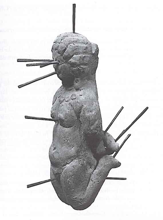 Figurine of a woman with pins on various parts of her body, discovered in the ancient greco-roman city of Antinoopolis. It was accompanied by a lengthy and intense love spell.jpg
