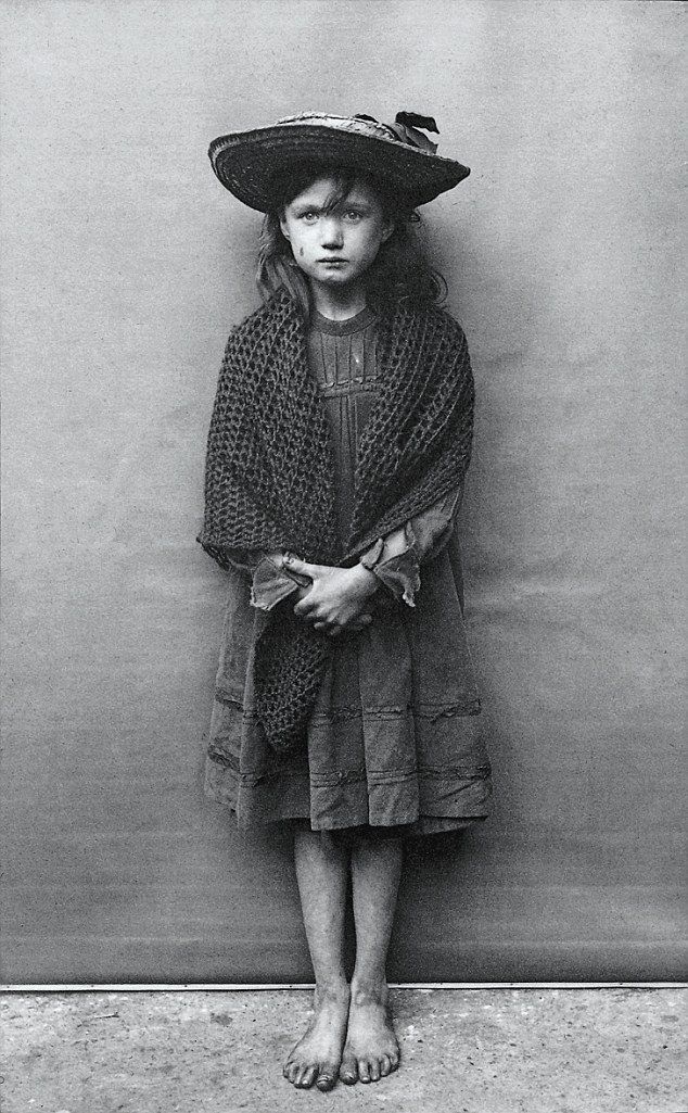 1901, Adelaide Springett in London, who was so ashamed at the state of her boots she took them off for a photograph.jpg