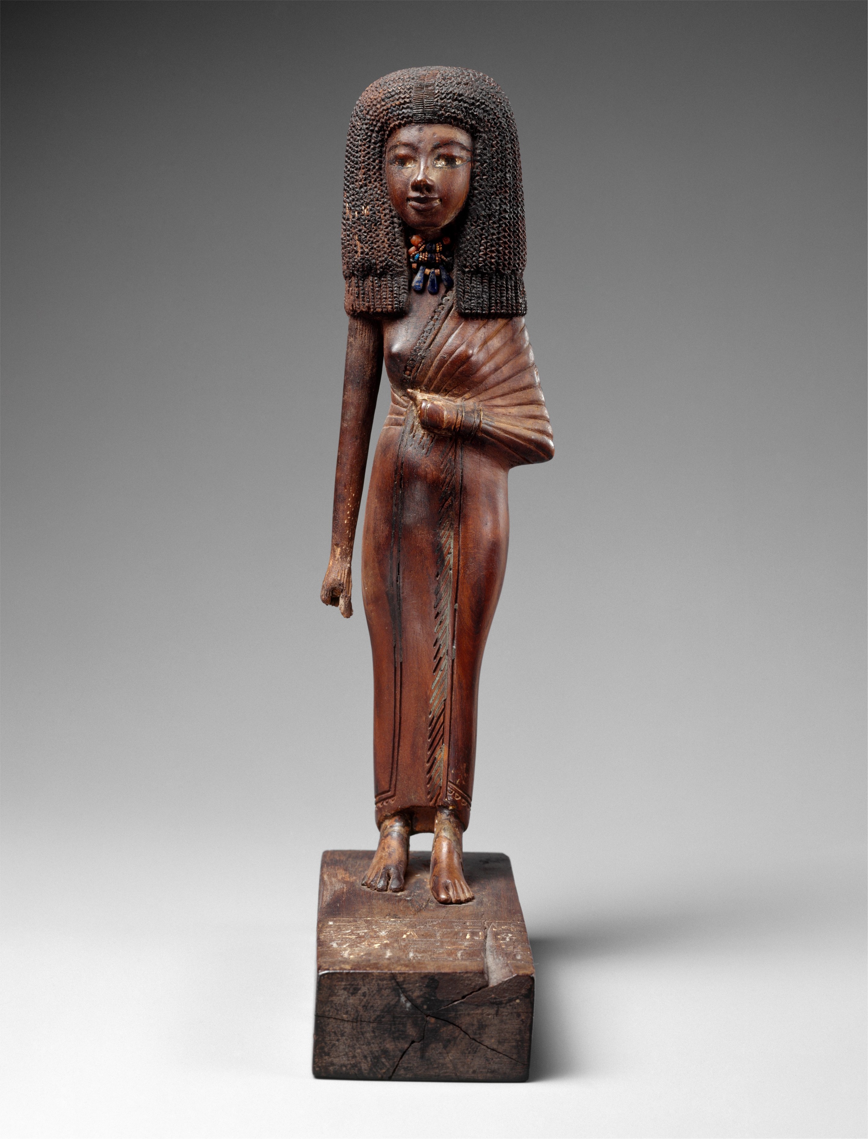 The mistress of the harem Tiye wears the voluminous wig and clinging dress of her time. Dated to ca. 1390–1349 B.C. Ancient Egypt.jpg