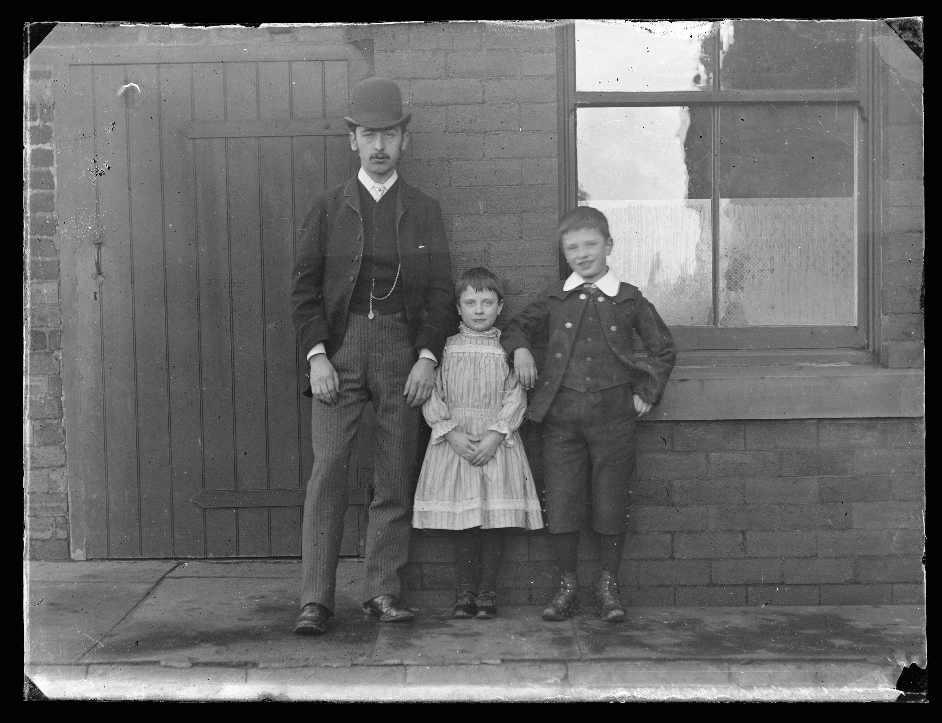 Family outside their house. Wales 1910s.jpg