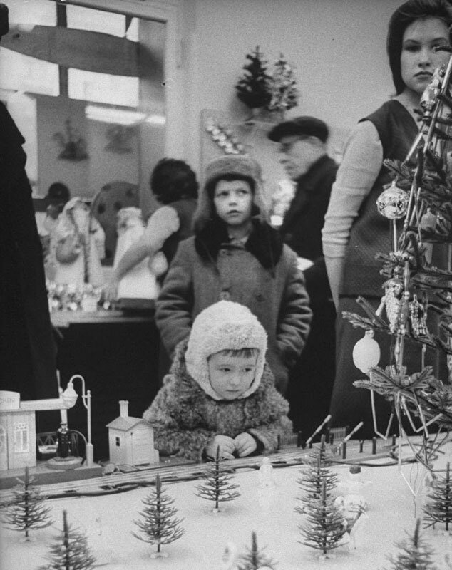 A little boy looking at a train set in a Moscow store. USSR, 1970s - By James Whitmore.jpg