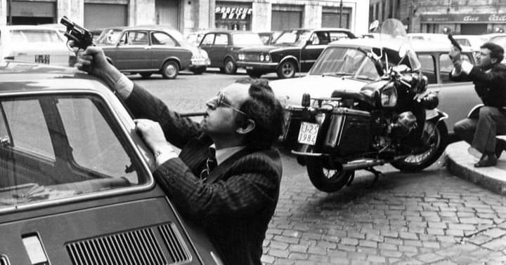 Rome, 1979, a cop with cigar and sunglasses during a shootout between red terrorists and Police.jpg