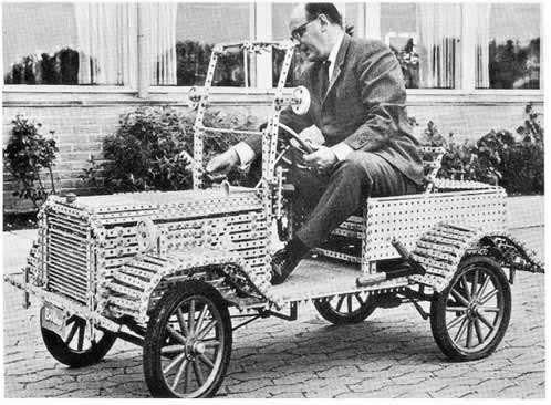 Ole Kirk Christiansen, inventor of LEGO, and his wooden car, 1930s.png