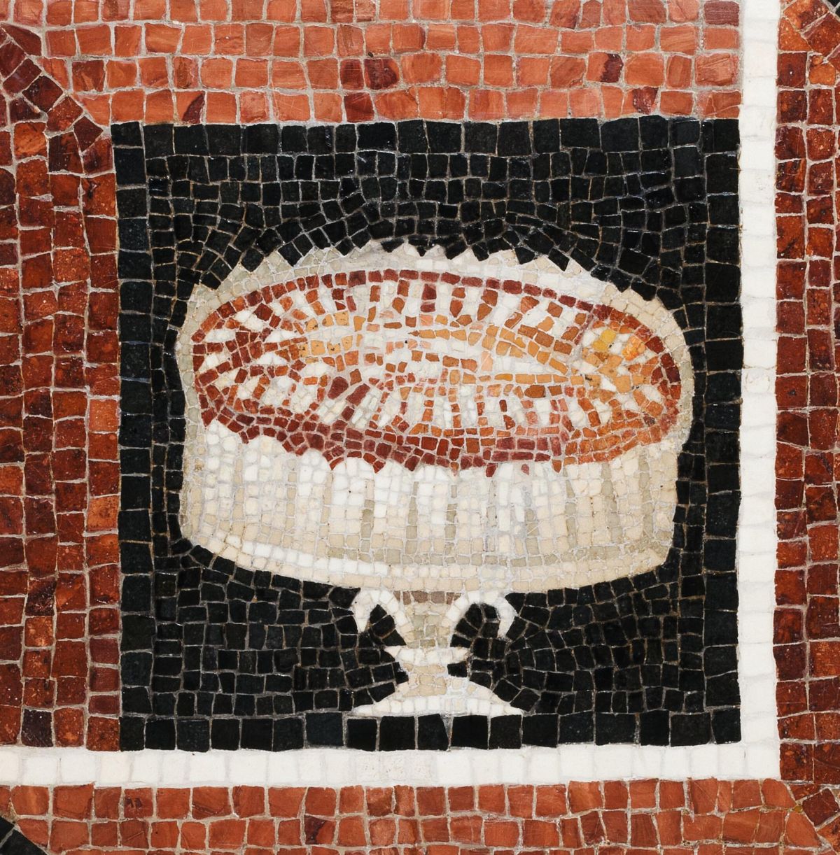 Roman mosaic flooring showing almond cake. Object dated to the 2nd century CE. The mosaic was discovered in 1823 in a vineyard in Monte Rosario, behind the Porta Portuensis gate in Rome.jpg