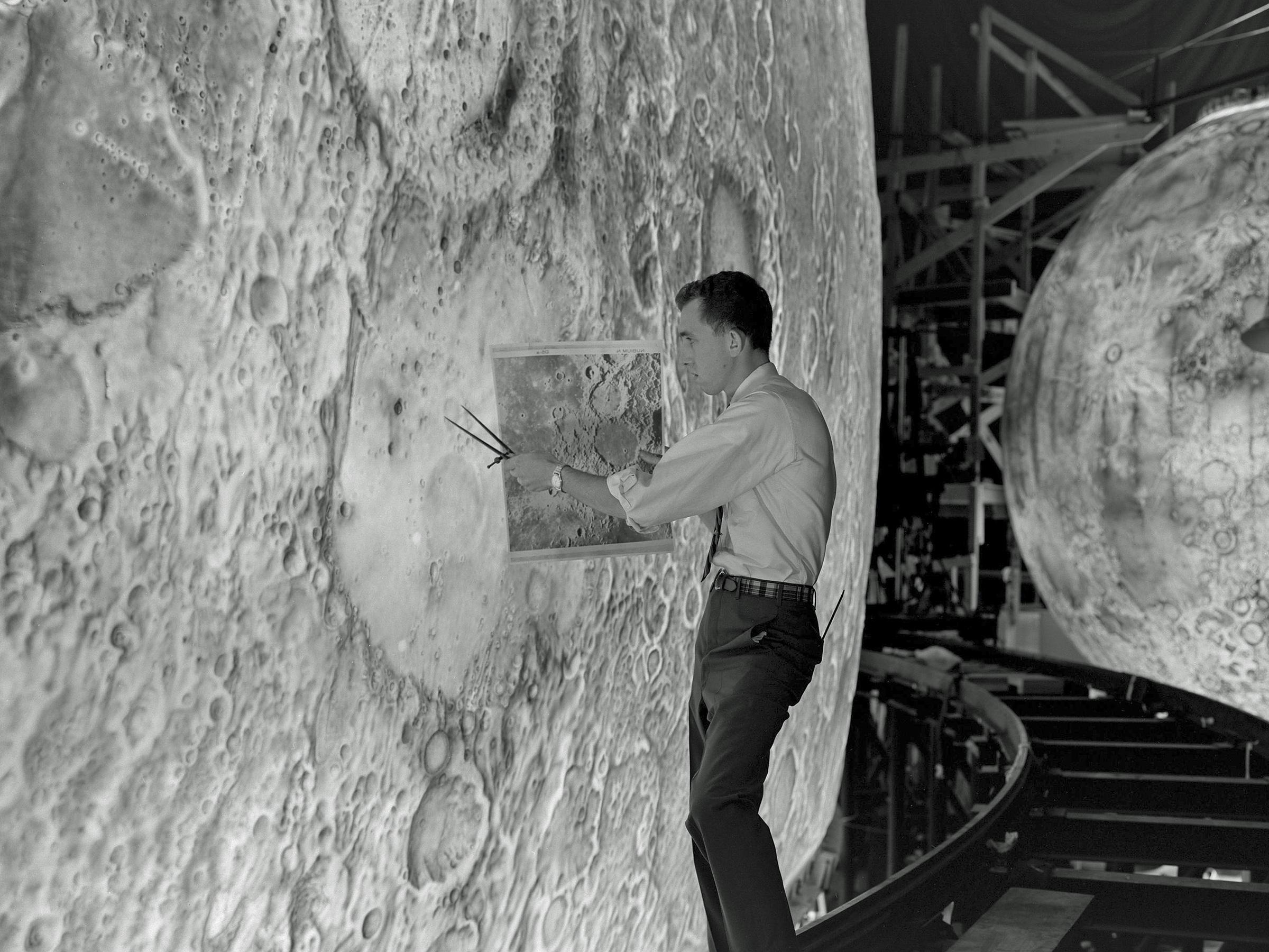 Artist recreating the lunar surface using paintbrushes and airbrushes for the Lunar Orbit and Landing Approach simulator at NASA in the early 1960’s.jpg